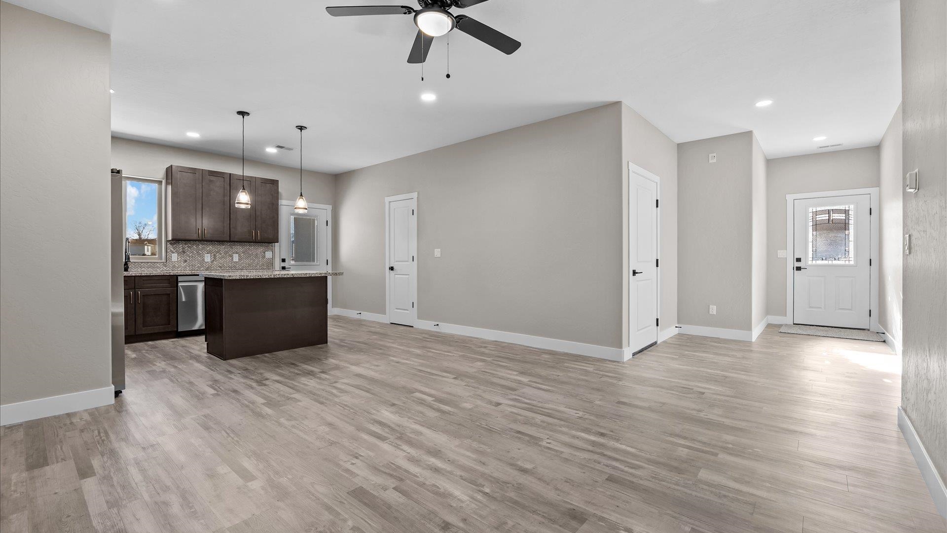 2642 B B 1/2 Road Grand Junction, CO 81503 - Photo 11 of 25 a view of an empty room with window and wooden floor