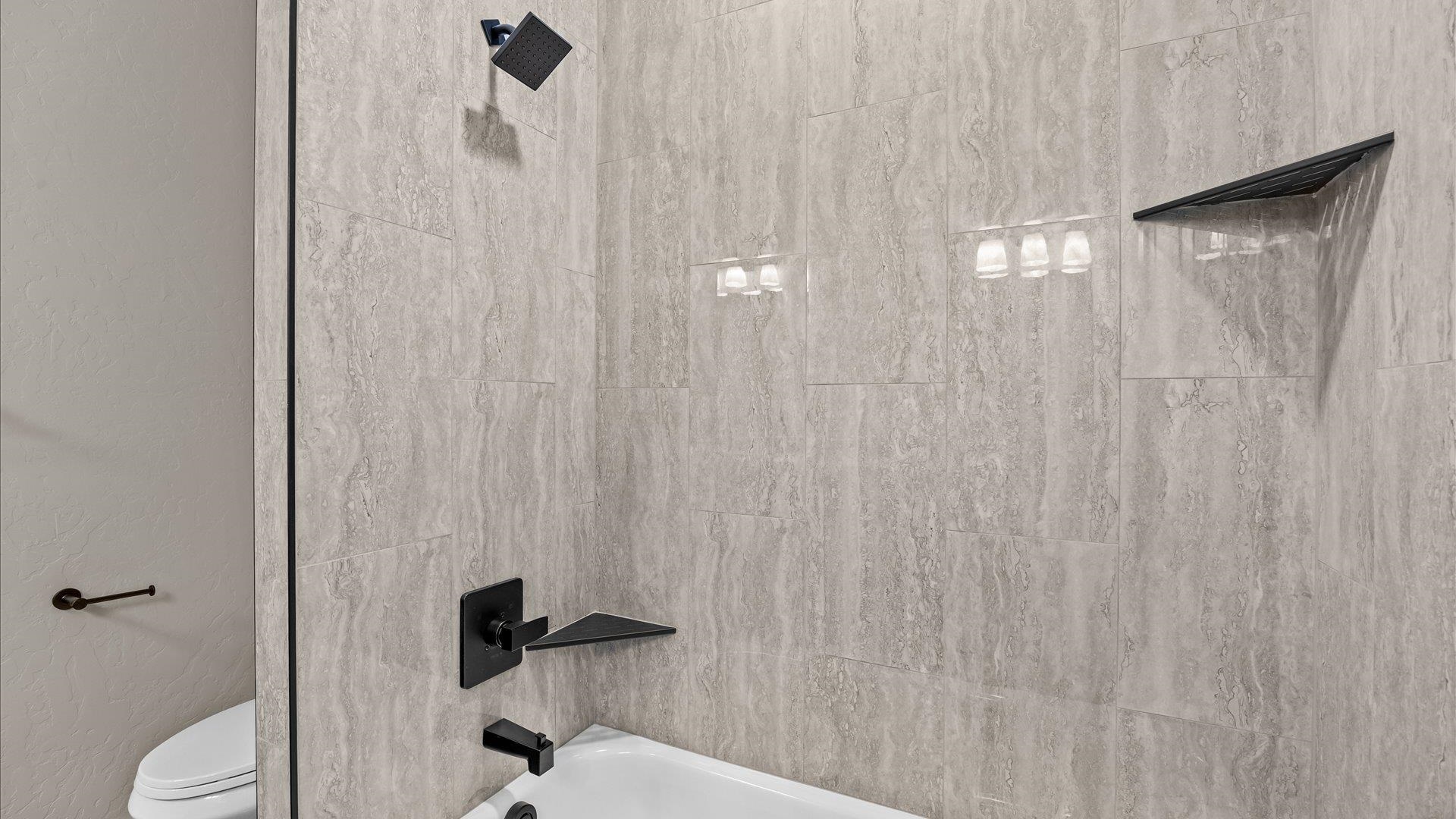 2642 B B 1/2 Road Grand Junction, CO 81503 - Photo 19 of 25 a bathroom with a shower curtain and a toilet