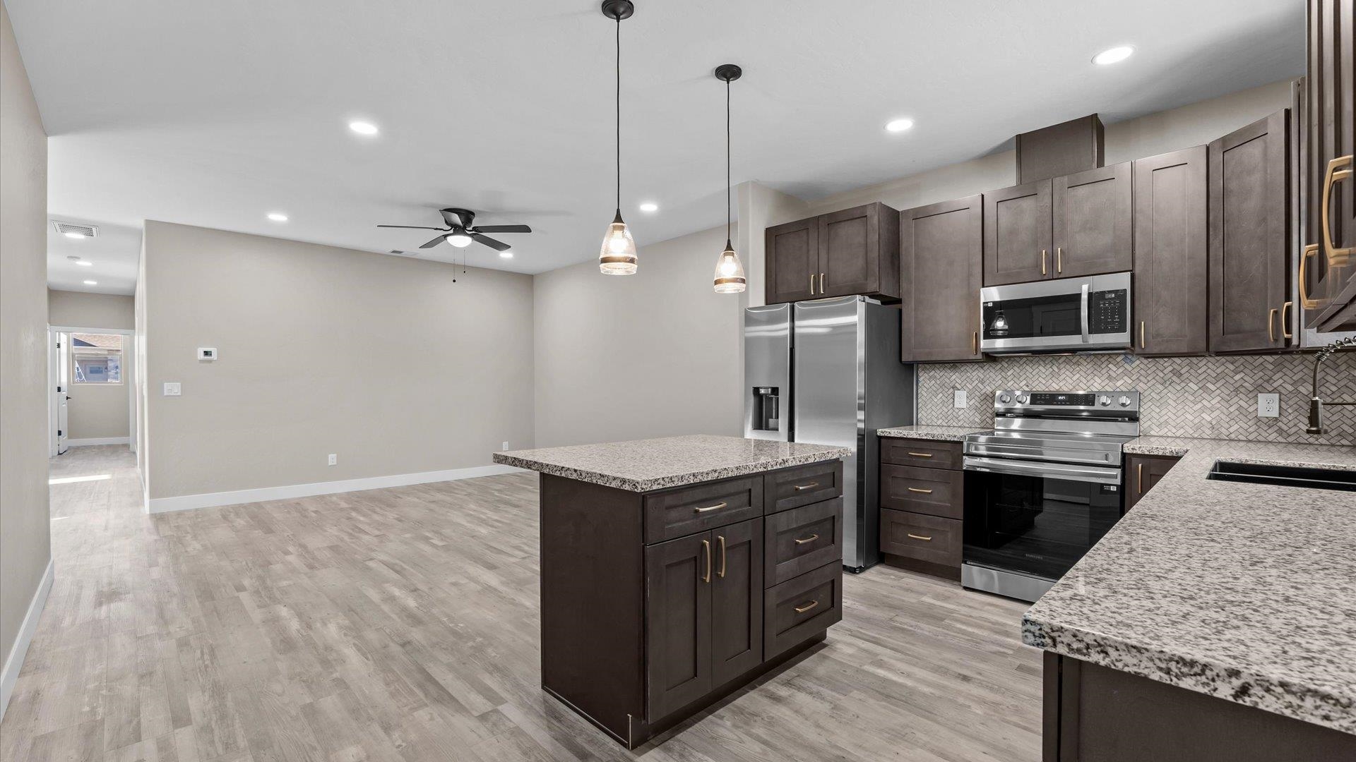 2642 B B 1/2 Road Grand Junction, CO 81503 - Photo 10 of 25 a kitchen with stainless steel appliances granite countertop a stove a sink and a refrigerator