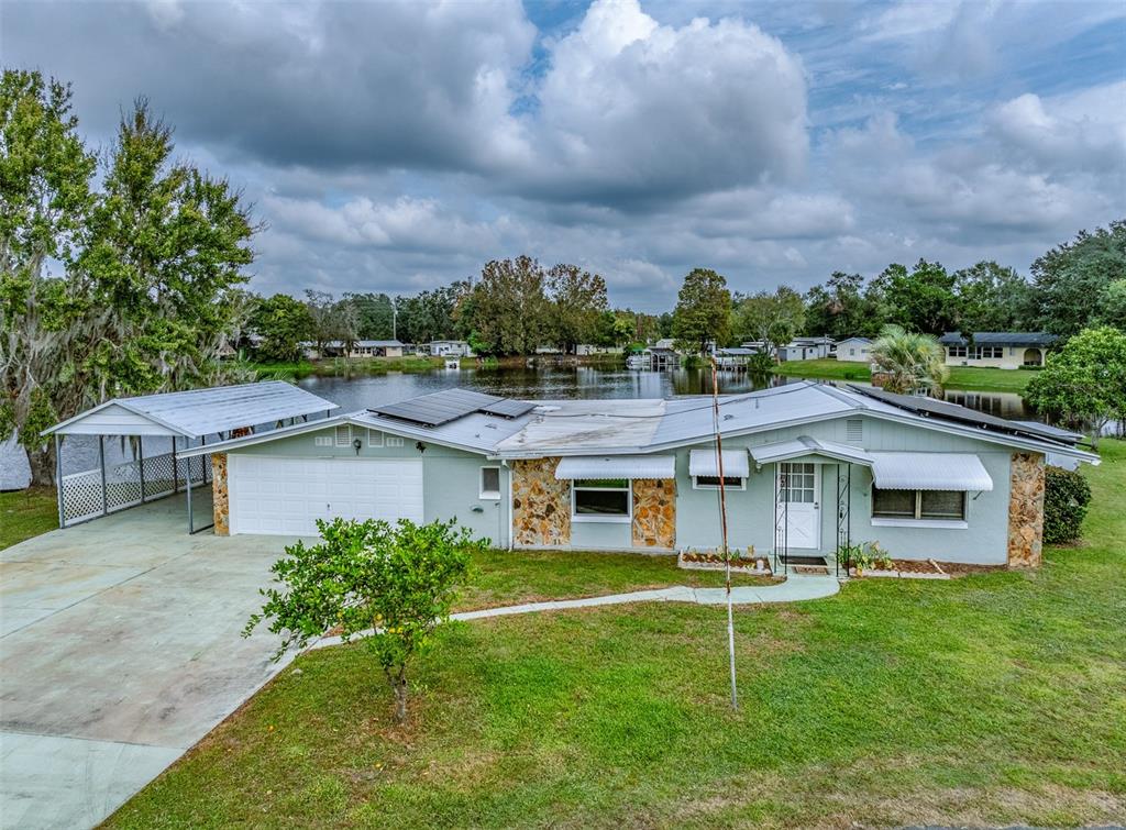 10115 East Perch Court Inverness, FL 34450 - Photo 1 of 1 a aerial view of a house with a big yard
