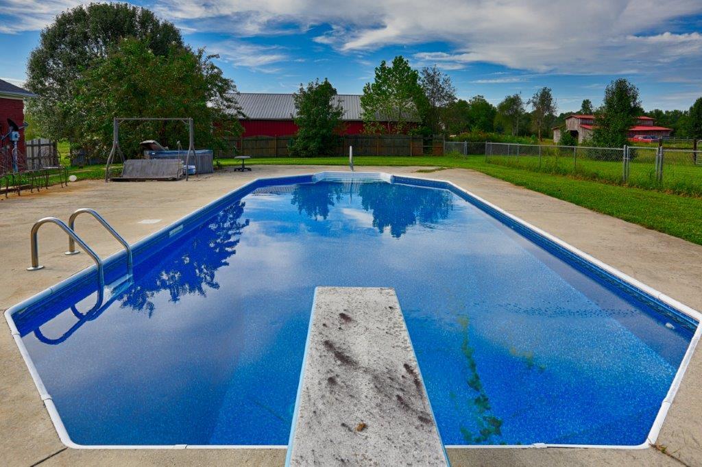 24 Henry Bayless Road Ardmore, TN 38449 - Photo 11 of 28 a view of swimming pool with outdoor seating and garden