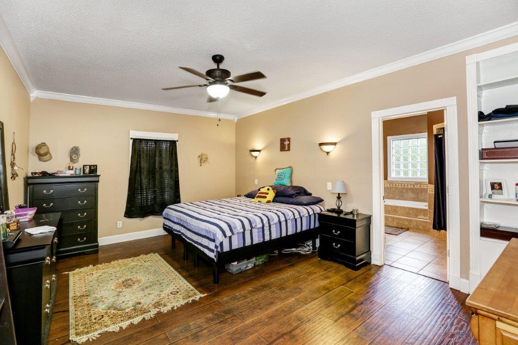 24 Henry Bayless Road Ardmore, TN 38449 - Photo 18 of 28 a bedroom with a bed and wooden floor