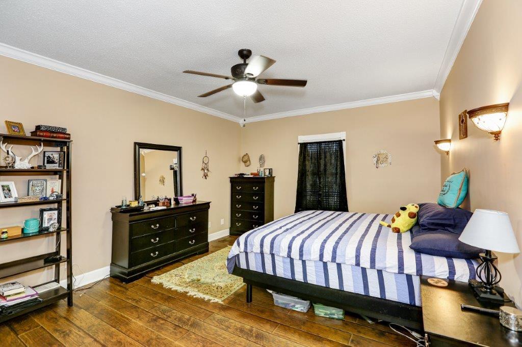 24 Henry Bayless Road Ardmore, TN 38449 - Photo 19 of 28 a bedroom with a bed and dresser