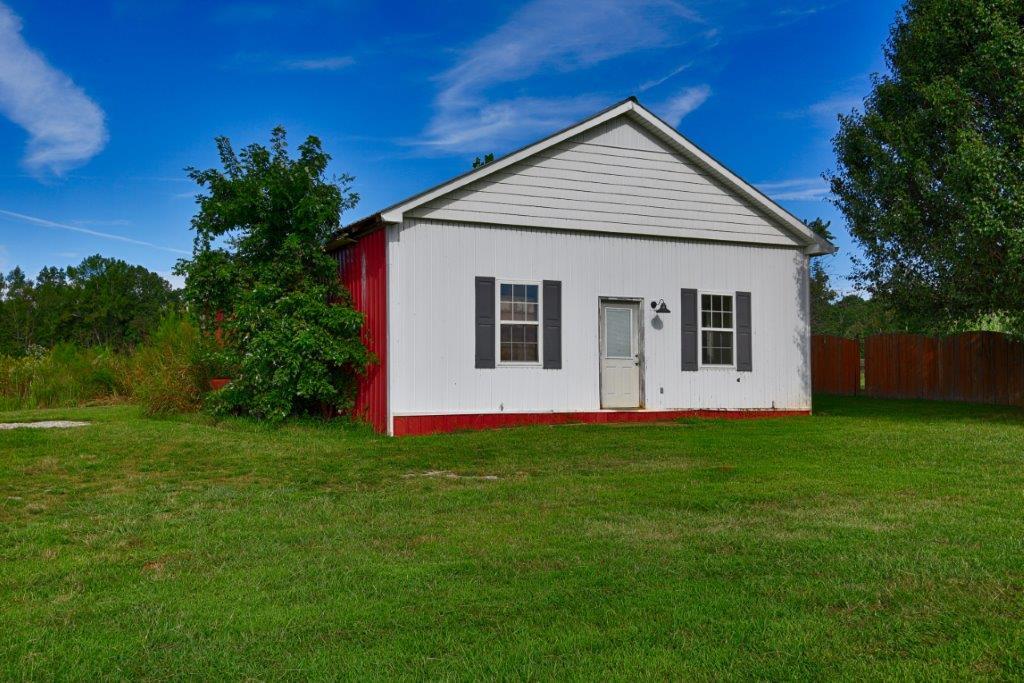 24 Henry Bayless Road Ardmore, TN 38449 - Photo 7 of 28 a view of a house with a backyard
