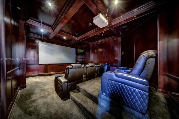 a media room with lots of chairs and a projector screen