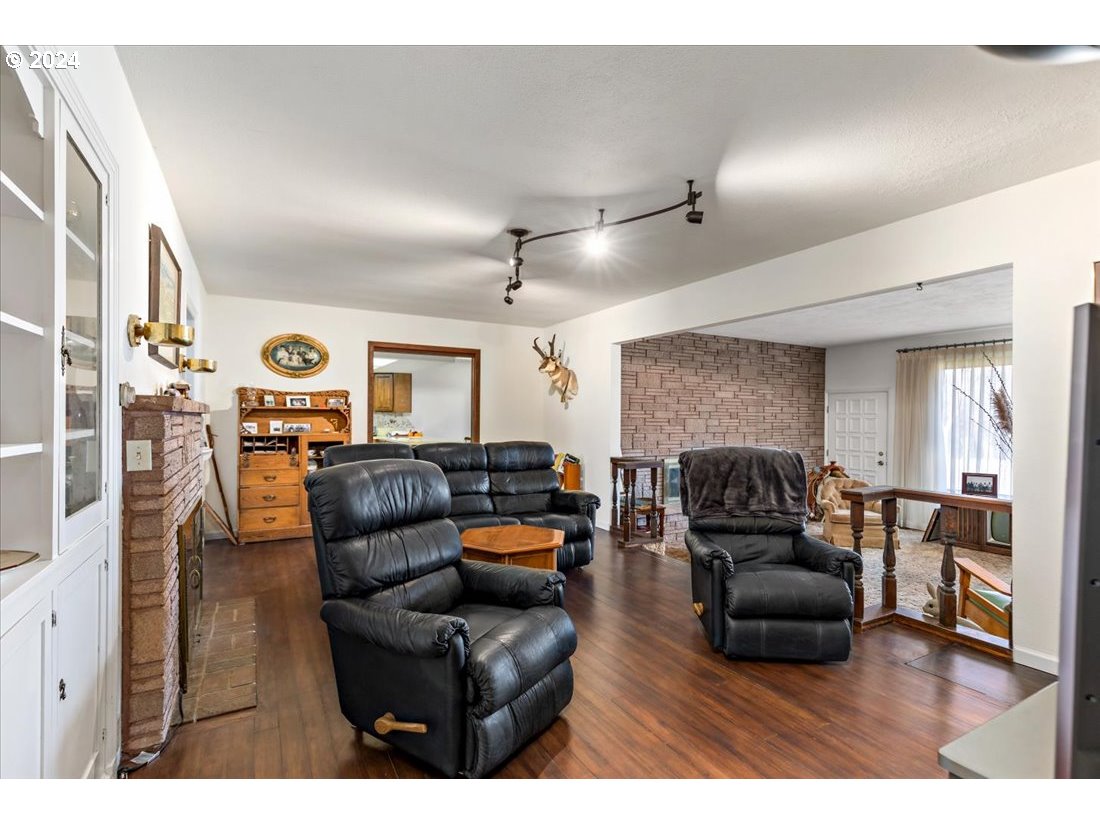 5645 Highway 201 Ontario, OR 97914 - Photo 26 of 32 a living room with furniture and a fireplace