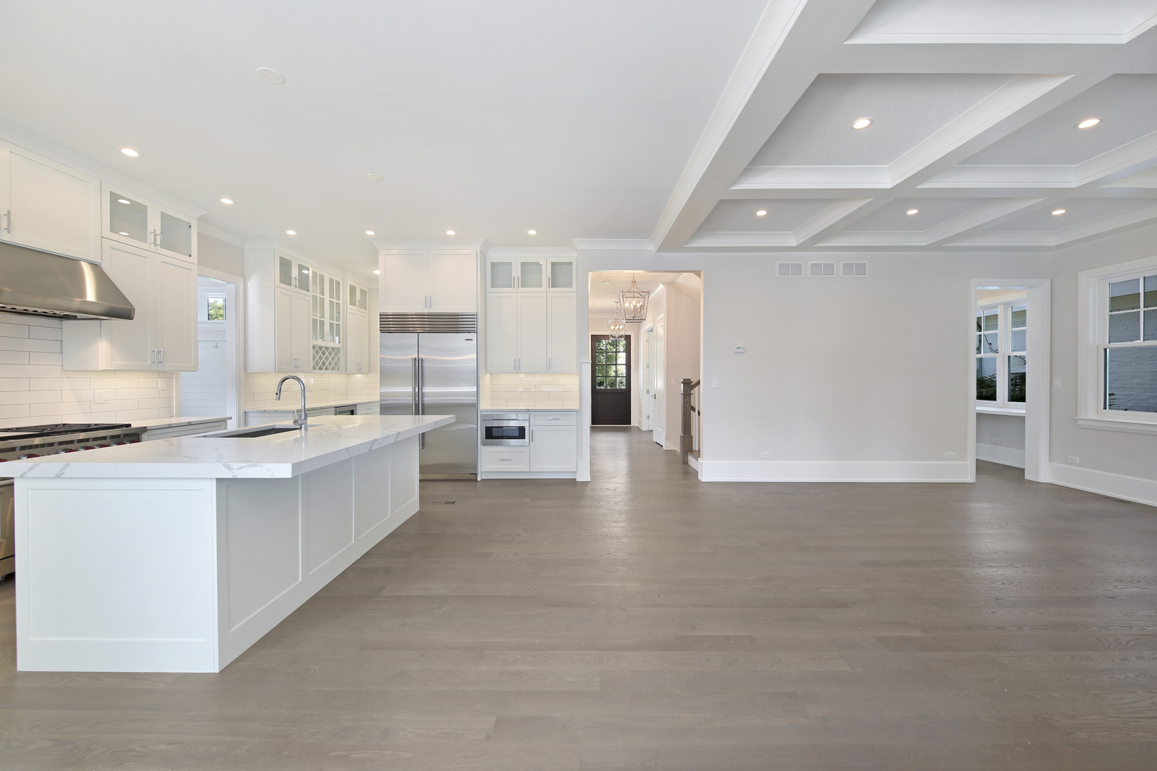 408 The Lane Hinsdale, IL 60521 - Photo 12 of 33 a large white kitchen with stainless steel appliances