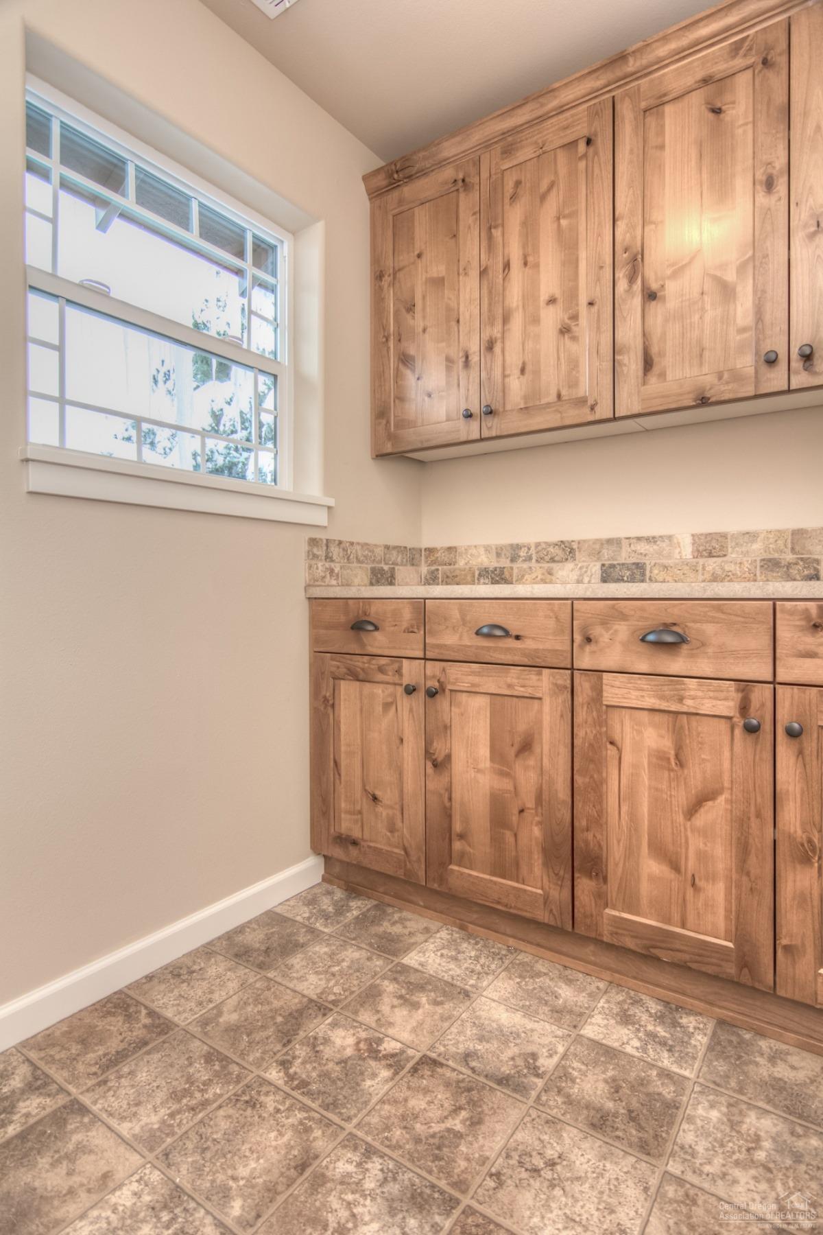 62720 Hawkview Road Bend, OR 97701 - Photo 16 of 16 a view of a kitchen with granite countertop cabinets