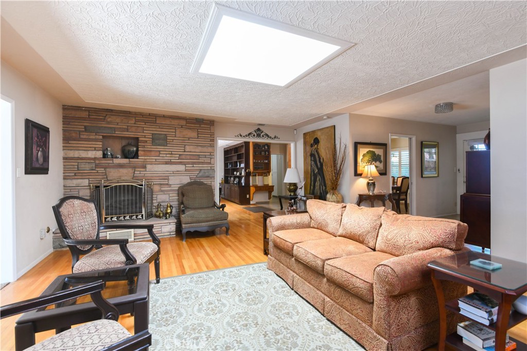 5382 Brighton Drive Riverside, CA 92504 - Photo 4 of 31 Living room with slump stone fireplace and skylight