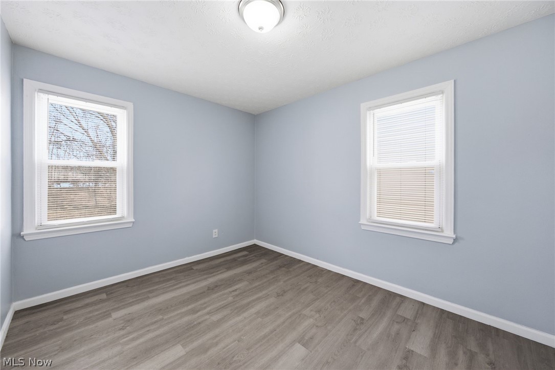 20705 Hansen Road Maple Heights, OH 44137 - Photo 8 of 24 Spare room featuring baseboards and wood finished floors