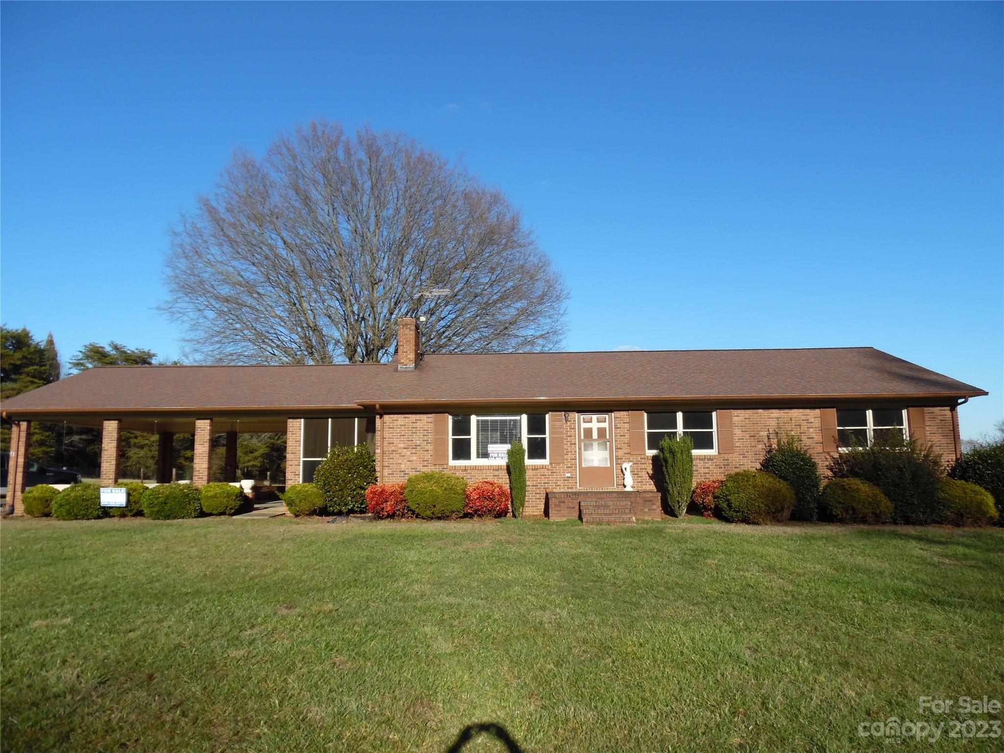 7728 Monbo Road Catawba, NC 28609 - Photo 1 of 39 a front view of a house with garden
