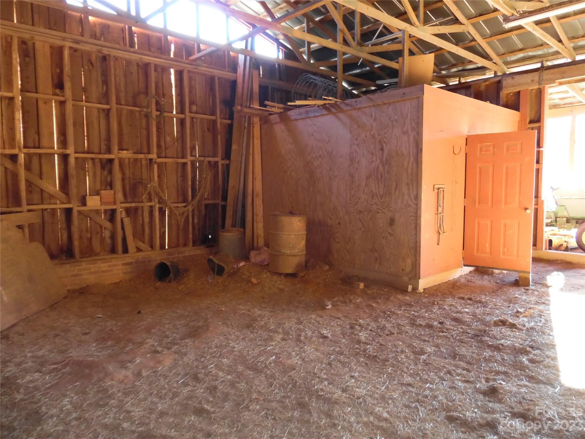 7728 Monbo Road Catawba, NC 28609 - Photo 12 of 39 a view of an empty room with wooden walls