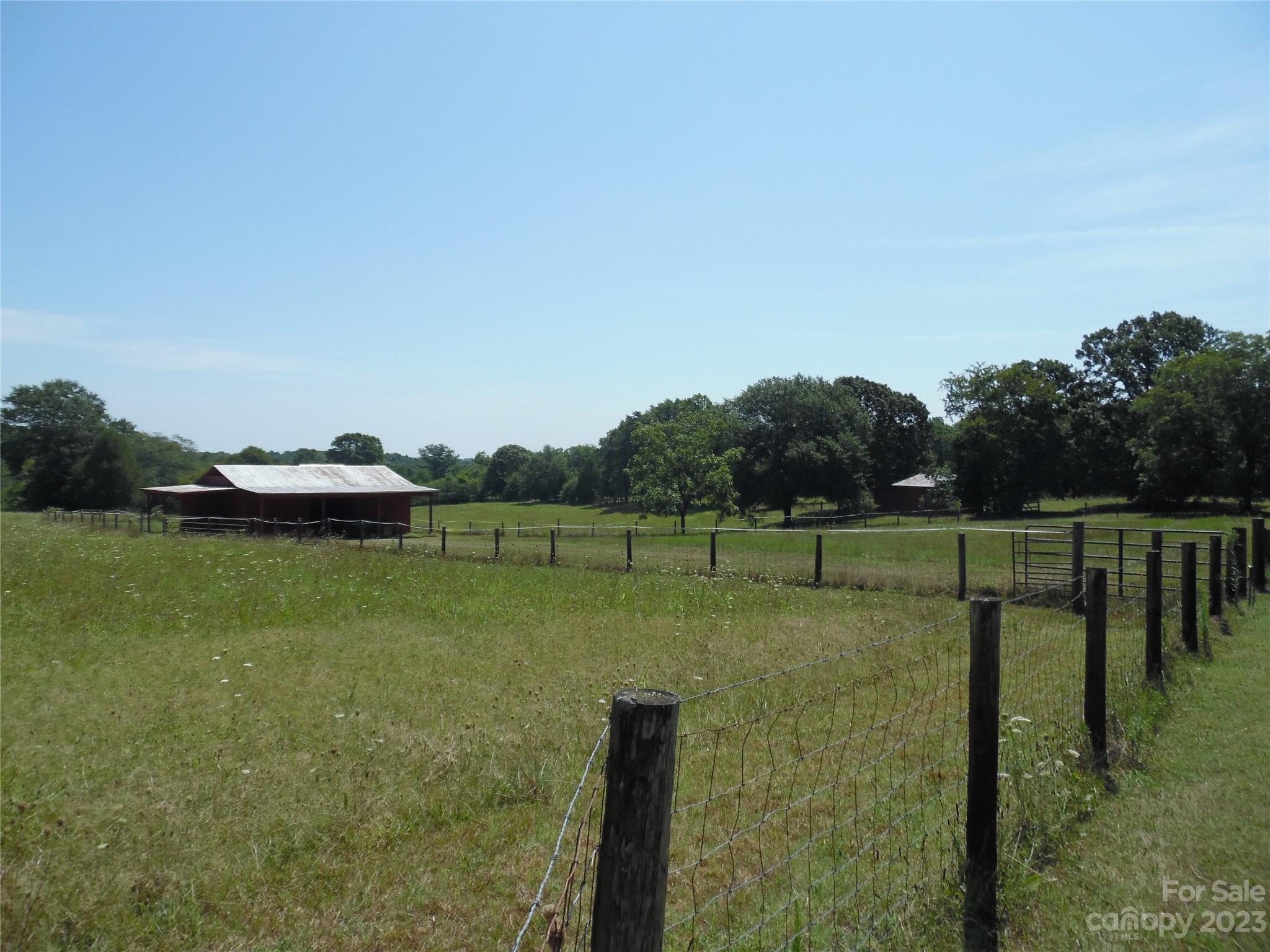 7728 Monbo Road Catawba, NC 28609 - Photo 18 of 39 a view of a lake with a yard