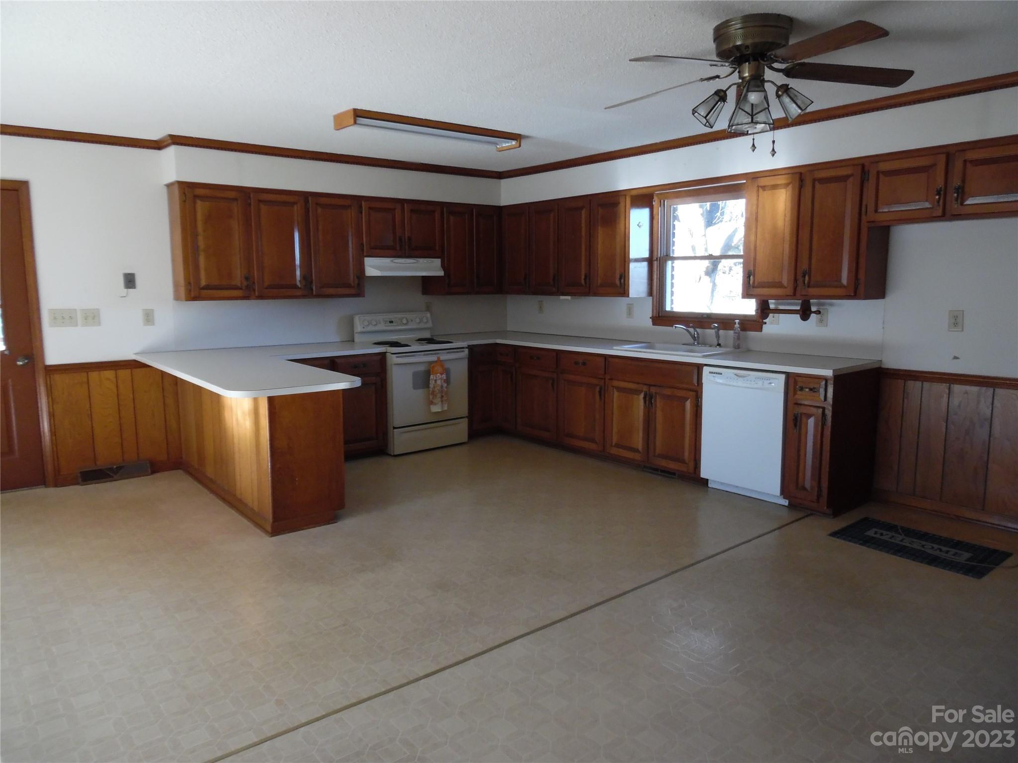 7728 Monbo Road Catawba, NC 28609 - Photo 21 of 39 a kitchen with stainless steel appliances granite countertop a stove sink and cabinets