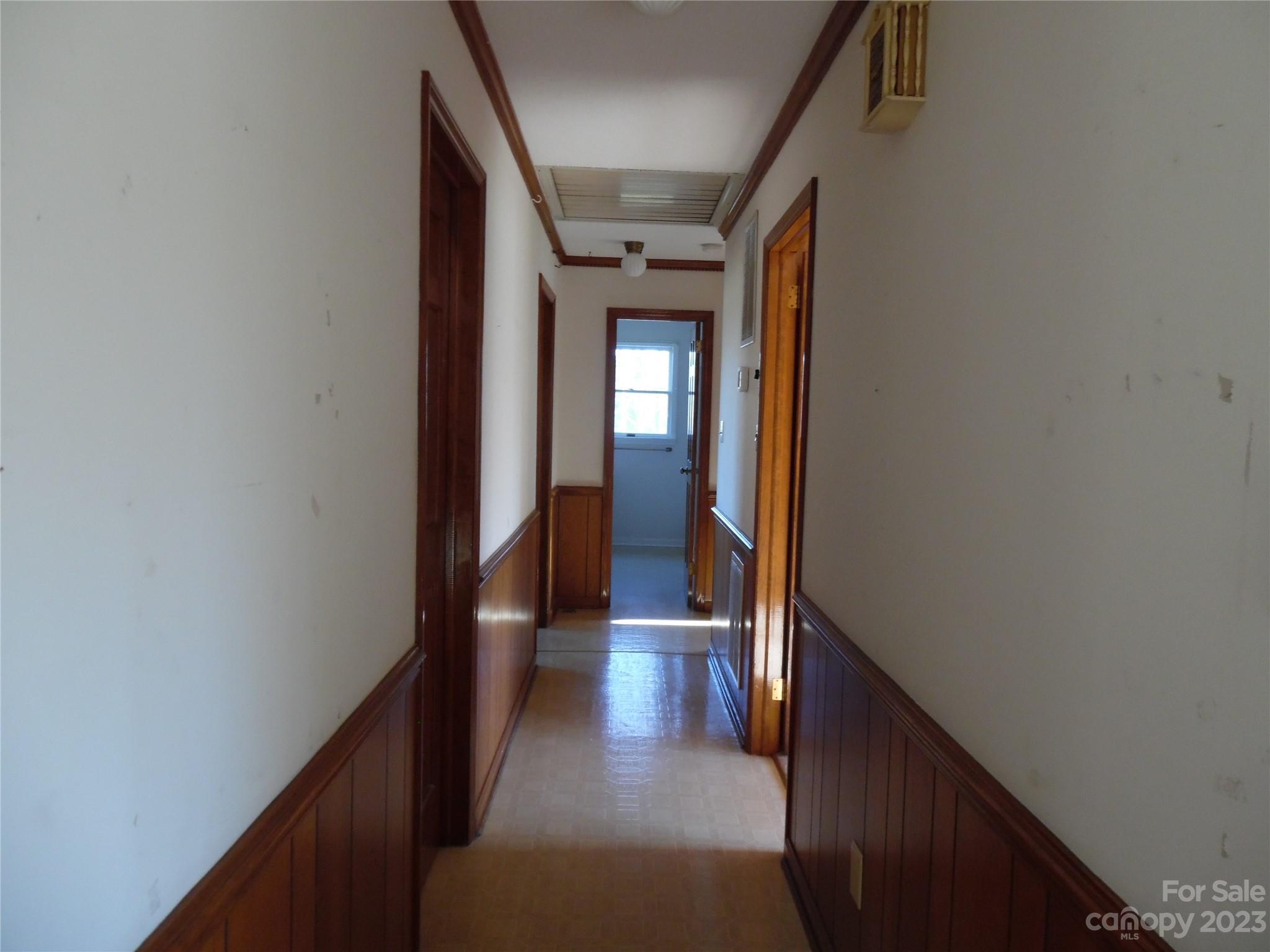 7728 Monbo Road Catawba, NC 28609 - Photo 27 of 39 a view of a hallway with wooden floor and staircase