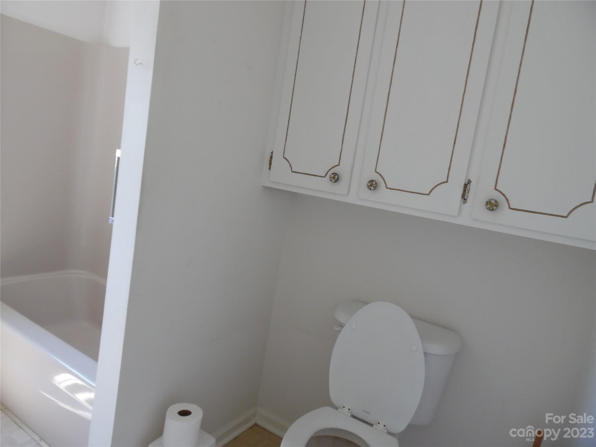 7728 Monbo Road Catawba, NC 28609 - Photo 30 of 39 a bathroom with a toilet and dryer