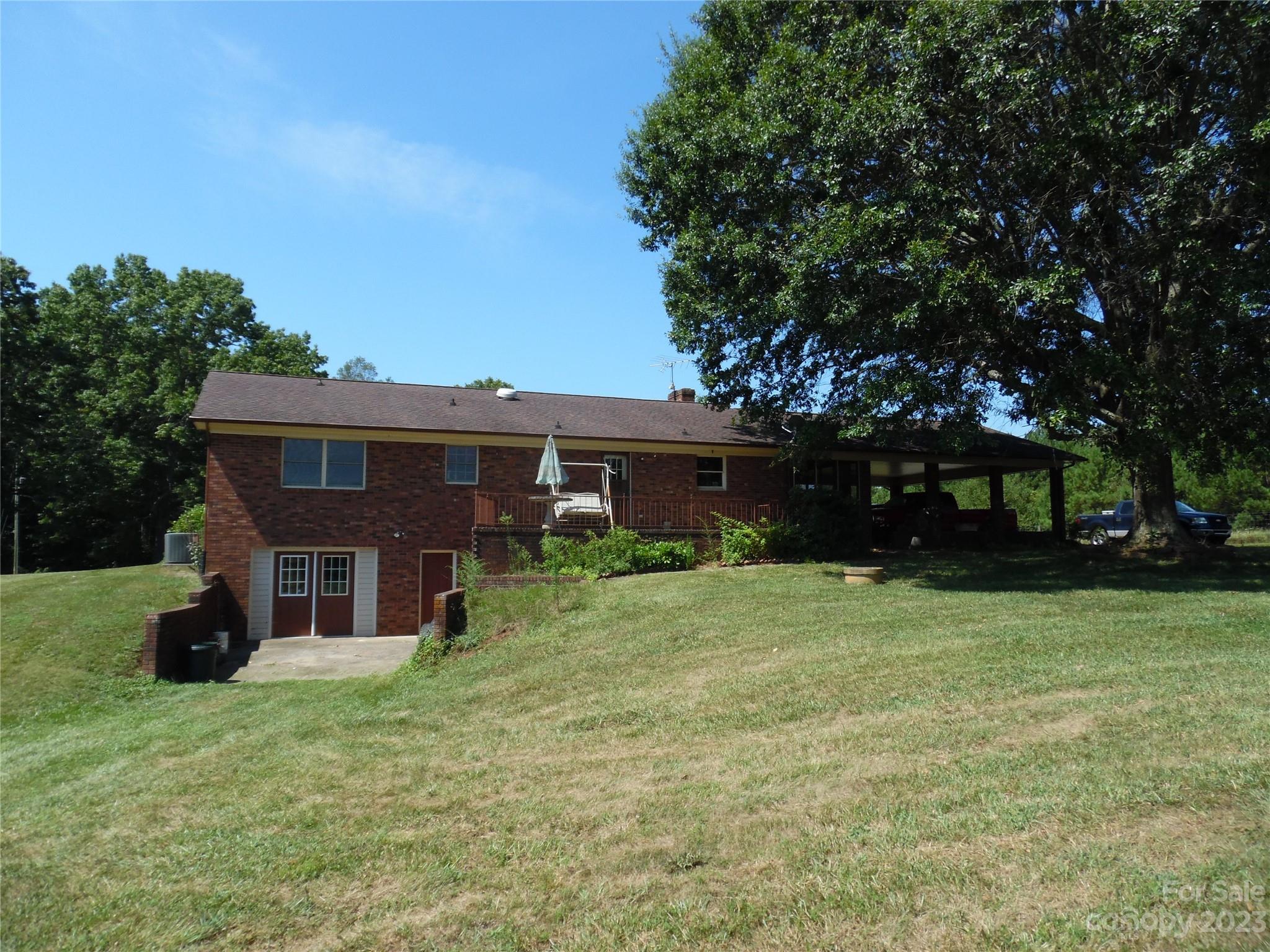 7728 Monbo Road Catawba, NC 28609 - Photo 3 of 39 a front view of a house with a yard and trees