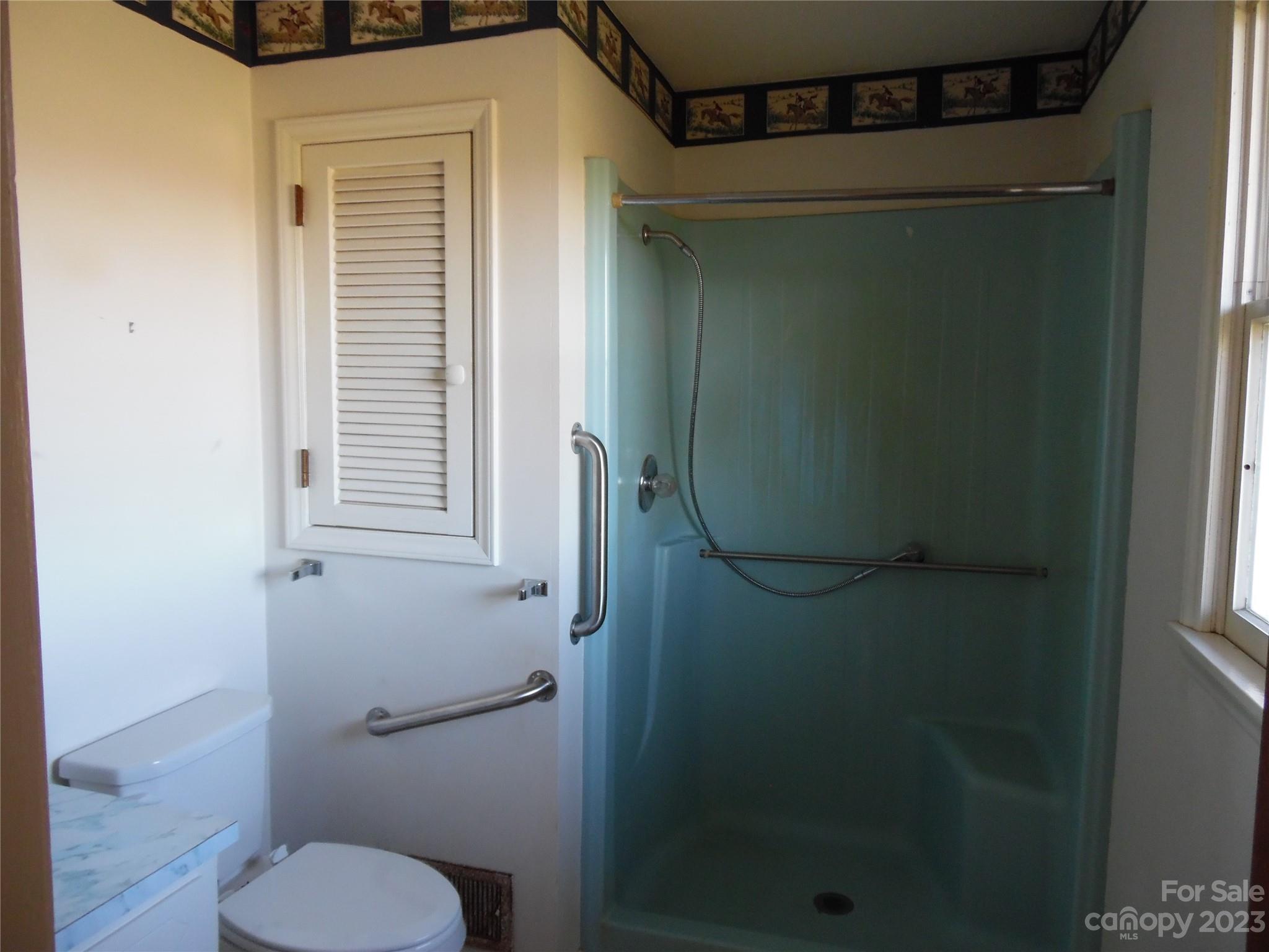 7728 Monbo Road Catawba, NC 28609 - Photo 33 of 39 a bathroom with a toilet and a shower