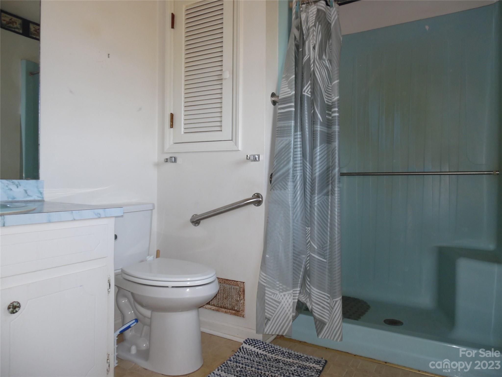 7728 Monbo Road Catawba, NC 28609 - Photo 34 of 39 a bathroom with a toilet and a shower