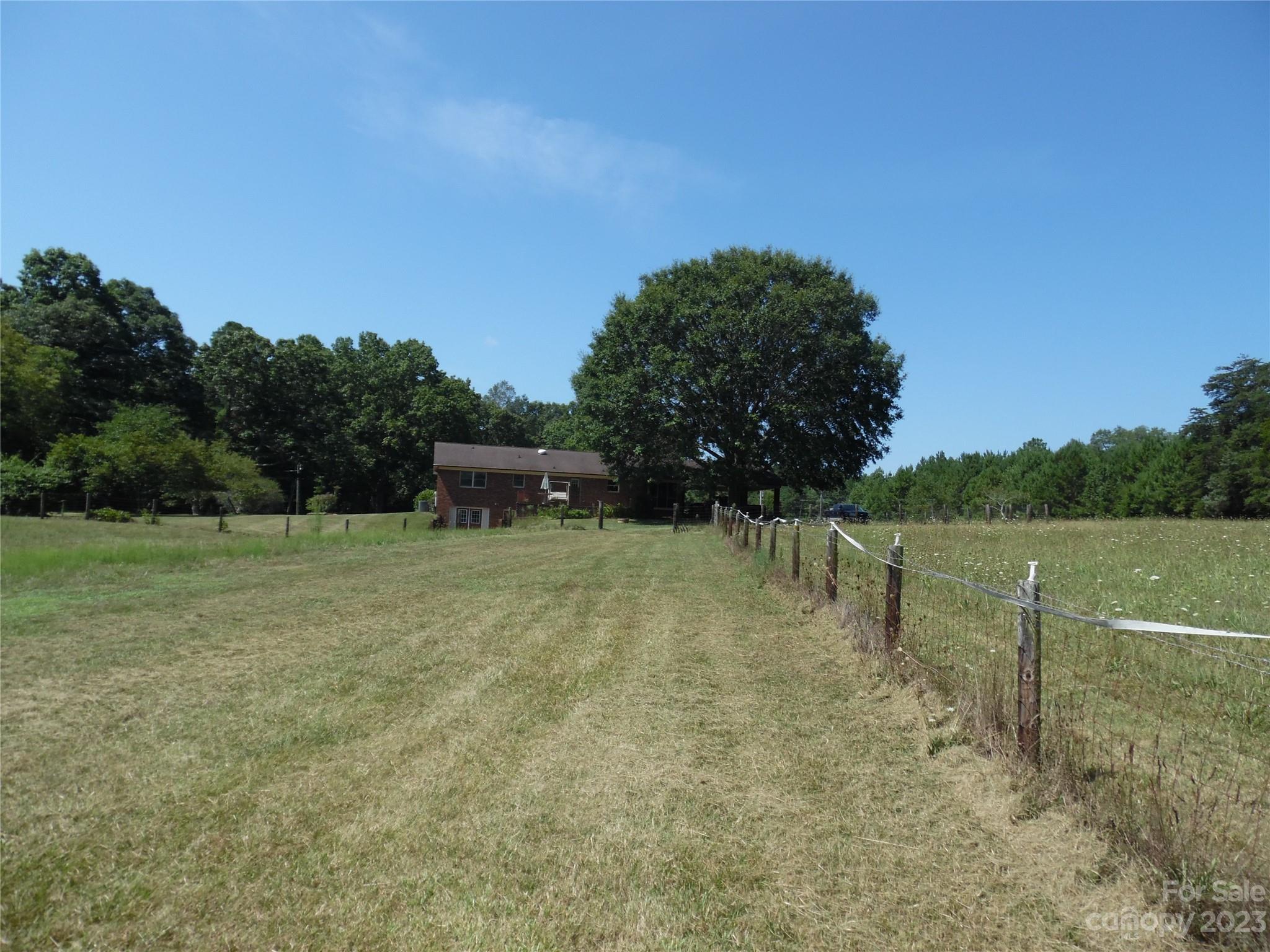 7728 Monbo Road Catawba, NC 28609 - Photo 7 of 39 a backyard of a house with lots of green space