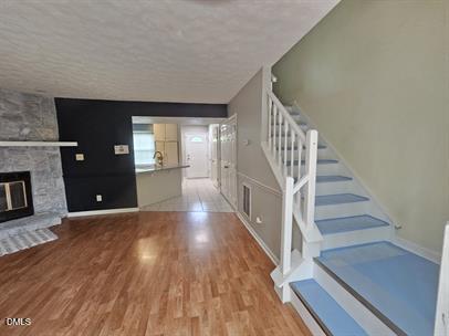8184 McGuire Drive Raleigh, NC 27616 - Photo 11 of 13 a view of entryway and hall with wooden floor