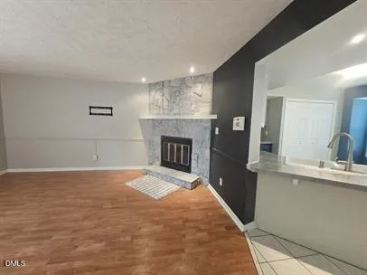 a bedroom with a bed and a fireplace