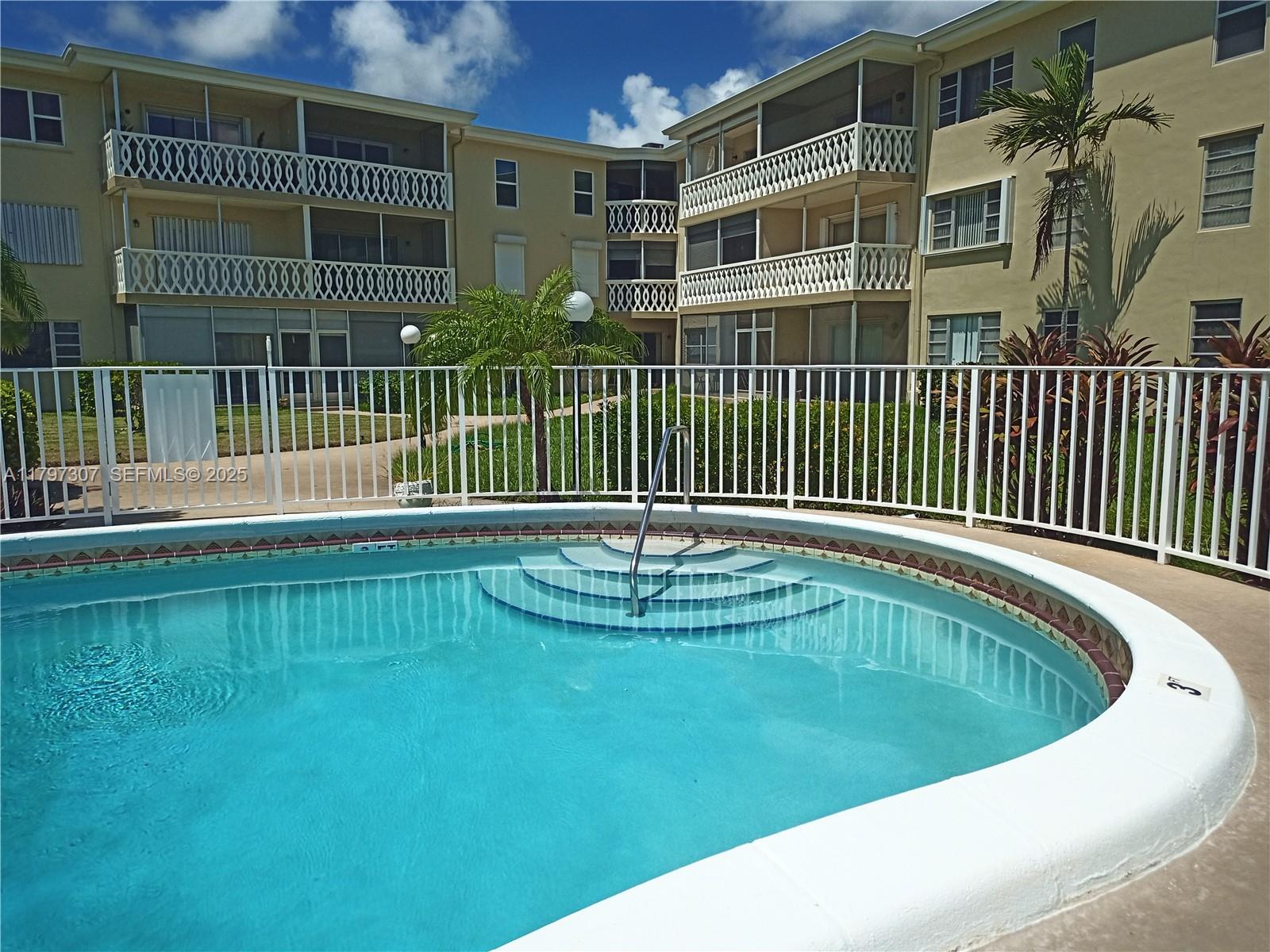 450 Golden Isles Drive, Unit 2H Hallandale Beach, FL 33009 - Photo 17 of 24 a view of swimming pool
