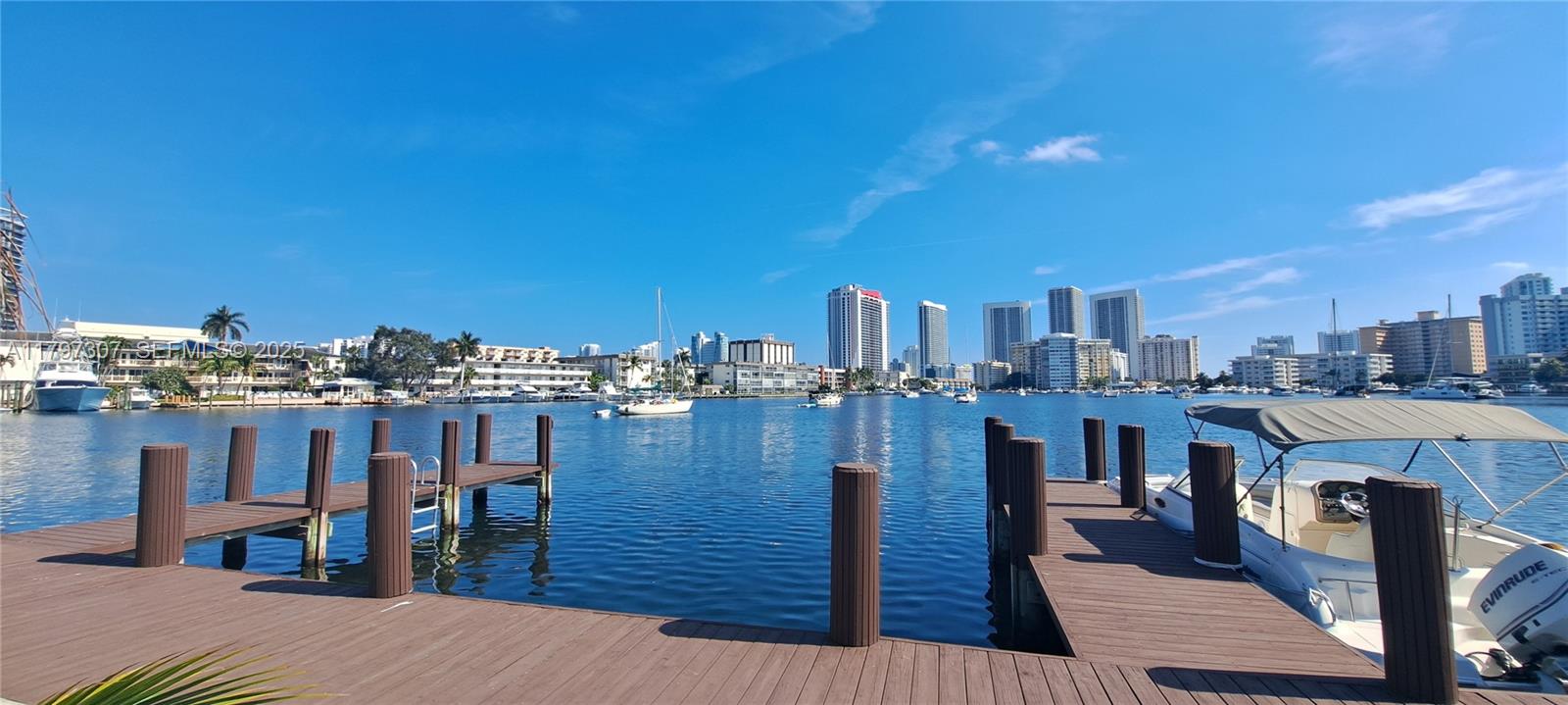 450 Golden Isles Drive, Unit 2H Hallandale Beach, FL 33009 - Photo 21 of 24 a view of a balcony with two chairs