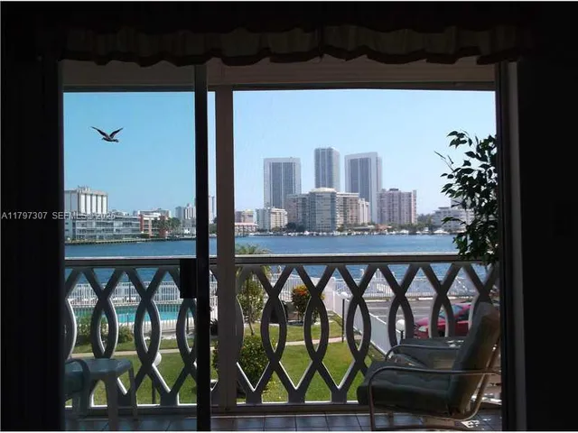 a view of a balcony and a potted plant