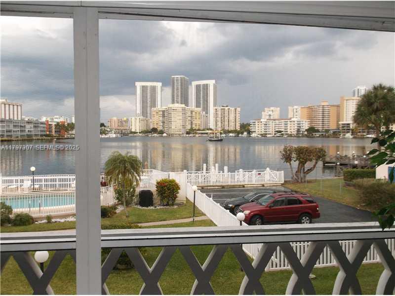 450 Golden Isles Drive, Unit 2H Hallandale Beach, FL 33009 - Photo 5 of 24 a view of a balcony and chairs