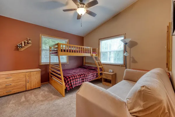 a bedroom with furniture and windows