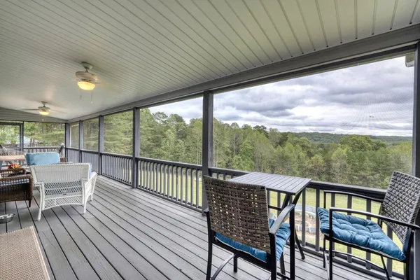 a view of a two chairs in the balcony