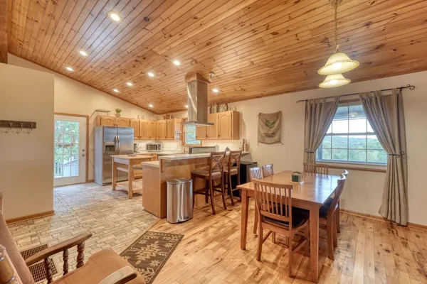 a dining room with furniture and window