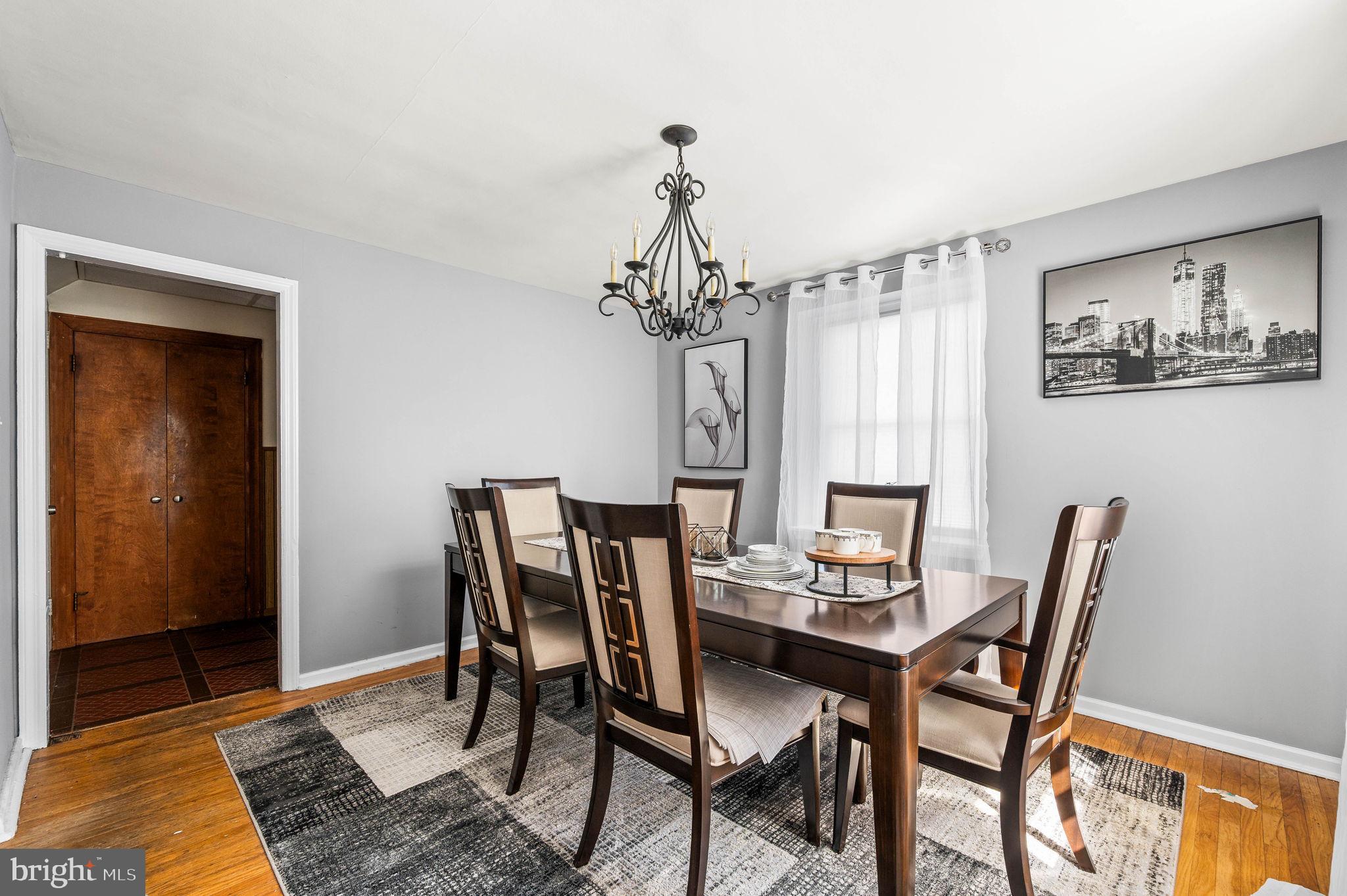 413 Maplewood Road Springfield, PA 19064 - Photo 8 of 21 a view of a dining room with furniture and chandelier