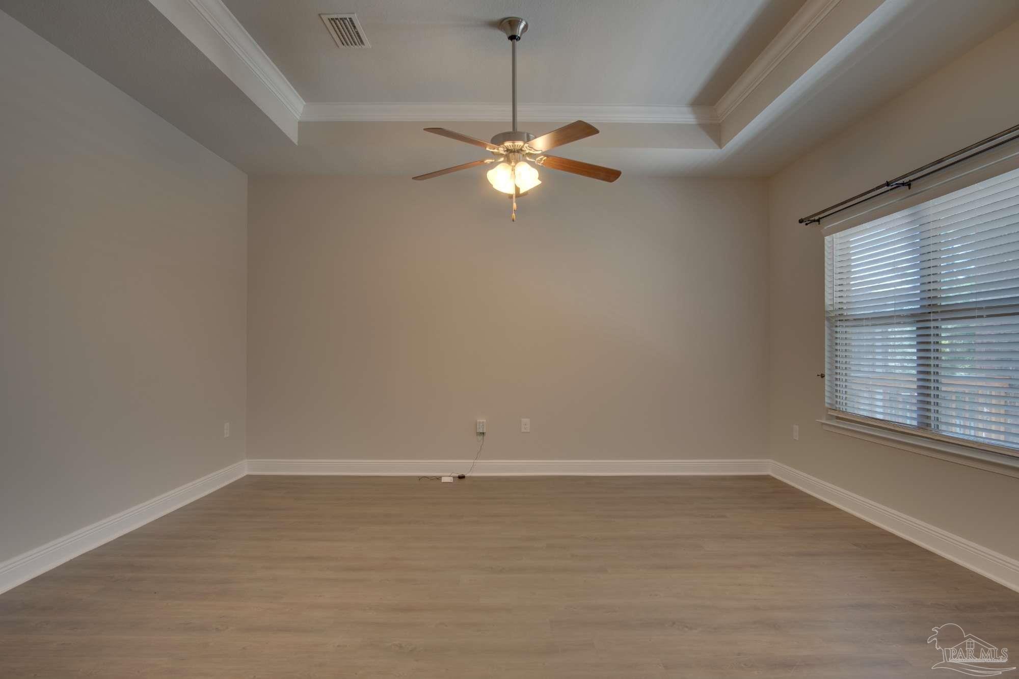 6239 Ladera Trail Pace, FL 32571 - Photo 14 of 27 a view of a room with a ceiling fan and window