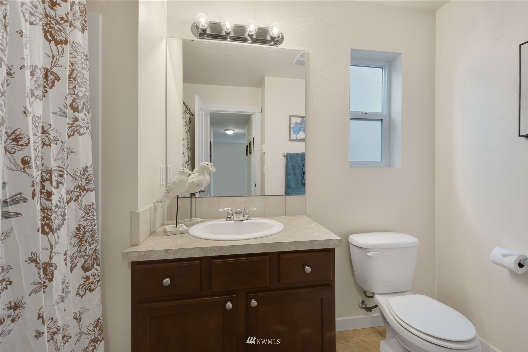 3712 224th Street Southeast Bothell, WA 98021 - Photo 13 of 24 a bathroom with a granite countertop toilet sink and mirror