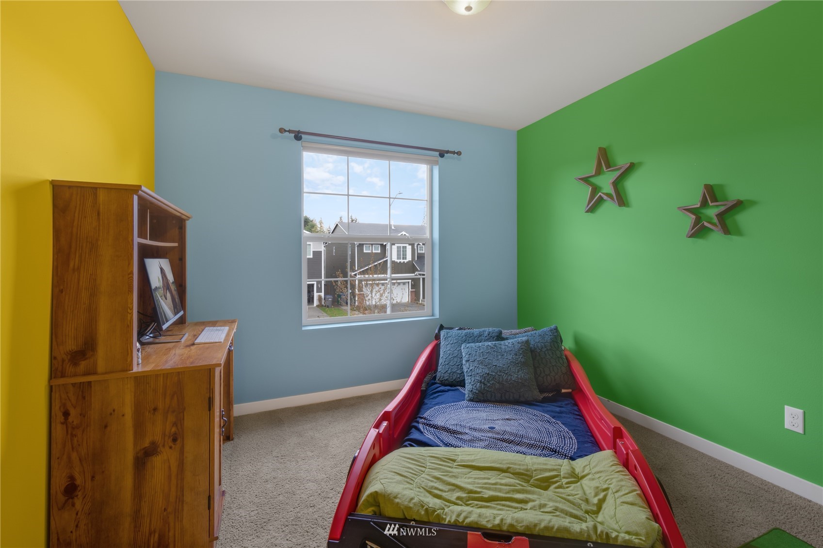 3712 224th Street Southeast Bothell, WA 98021 - Photo 15 of 24 a bed room with furniture and a flat screen tv