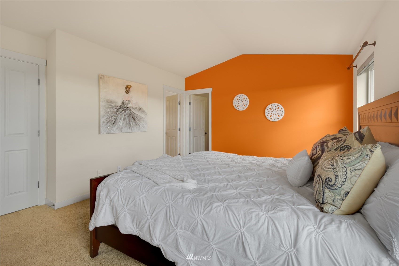 3712 224th Street Southeast Bothell, WA 98021 - Photo 18 of 24 a bedroom with a bed and a painting on the wall