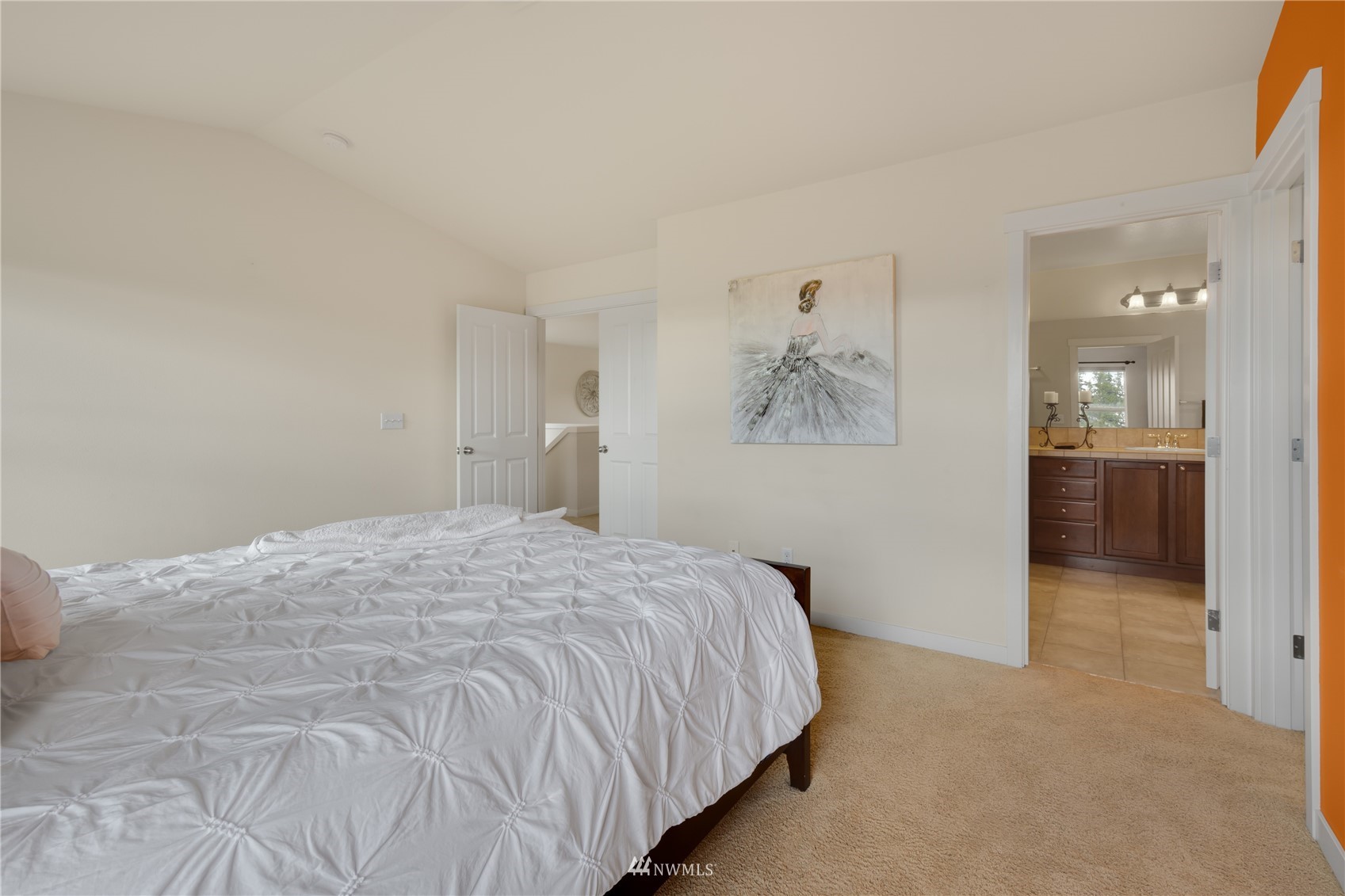 3712 224th Street Southeast Bothell, WA 98021 - Photo 19 of 24 a bedroom with a bed and a painting on the wall