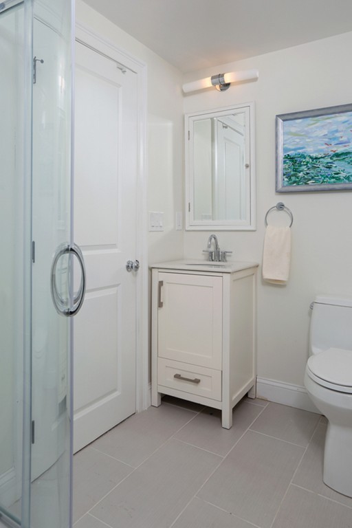 31 Buswell Park Newton, MA 02458 - Photo 19 of 20 a bathroom with a sink a toilet and vanity