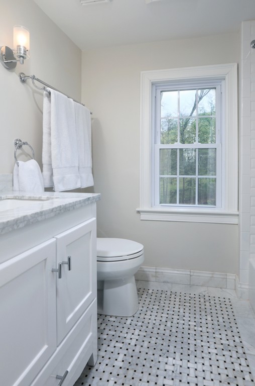 31 Buswell Park Newton, MA 02458 - Photo 20 of 20 a bathroom with a sink a toilet and a window