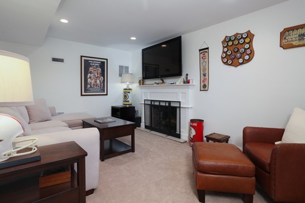 31 Buswell Park Newton, MA 02458 - Photo 7 of 20 a living room with furniture fireplace and flat screen tv