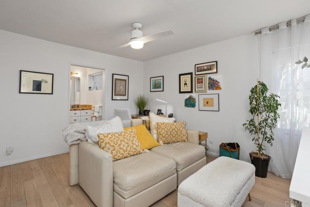 940 Sealane Drive, Unit 3 Encinitas, CA 92024 - Photo 22 of 29 a living room with furniture and flowers