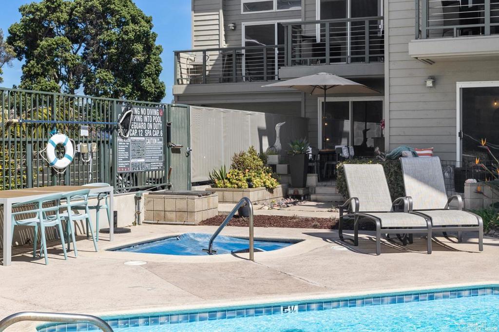 940 Sealane Drive, Unit 3 Encinitas, CA 92024 - Photo 26 of 29 a view of a chairs and table in patio