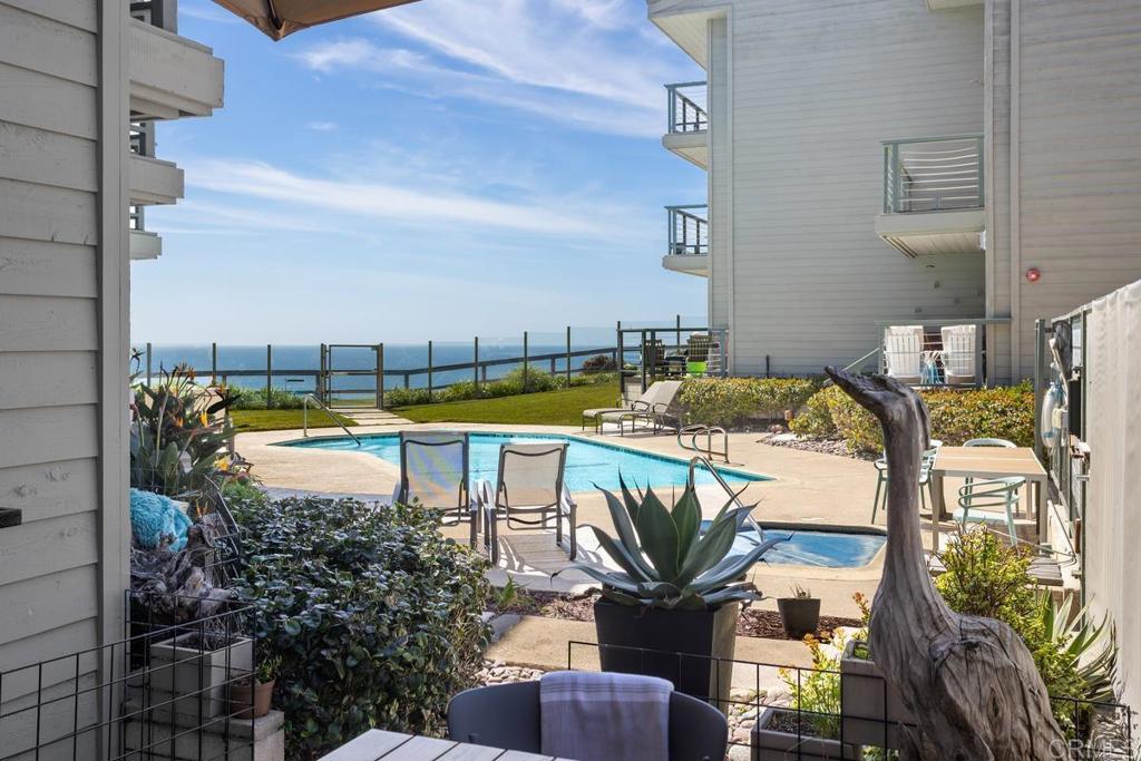 940 Sealane Drive, Unit 3 Encinitas, CA 92024 - Photo 3 of 29 a view of swimming pool with outdoor seating and city view
