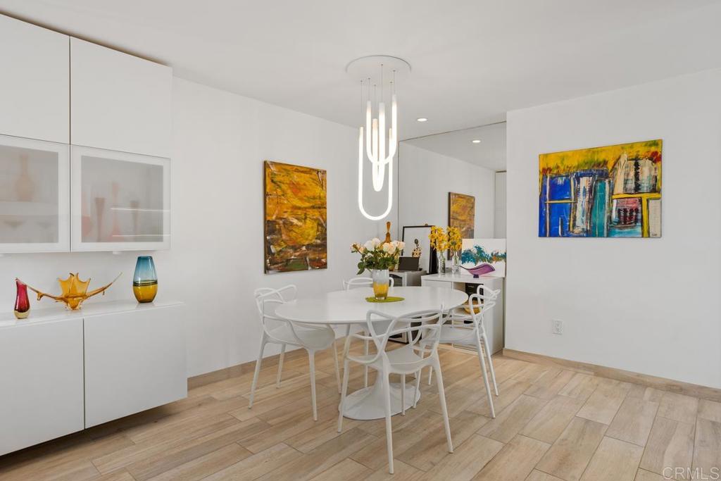 940 Sealane Drive, Unit 3 Encinitas, CA 92024 - Photo 9 of 29 a view of a dining room with furniture and wooden floor