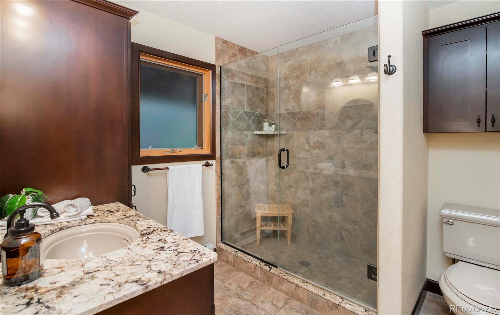 13416 Kuehster Road Littleton, CO 80127 - Photo 24 of 50 a bathroom with a sink and a mirror