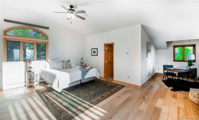 a bed room with a bed and a chandelier