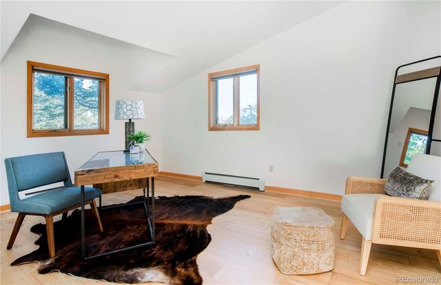 a balcony with table and chairs