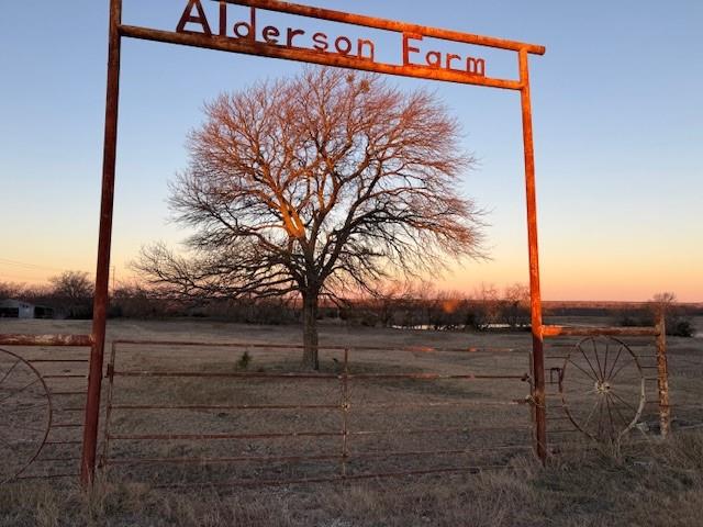 a view of a street with a building on the road
